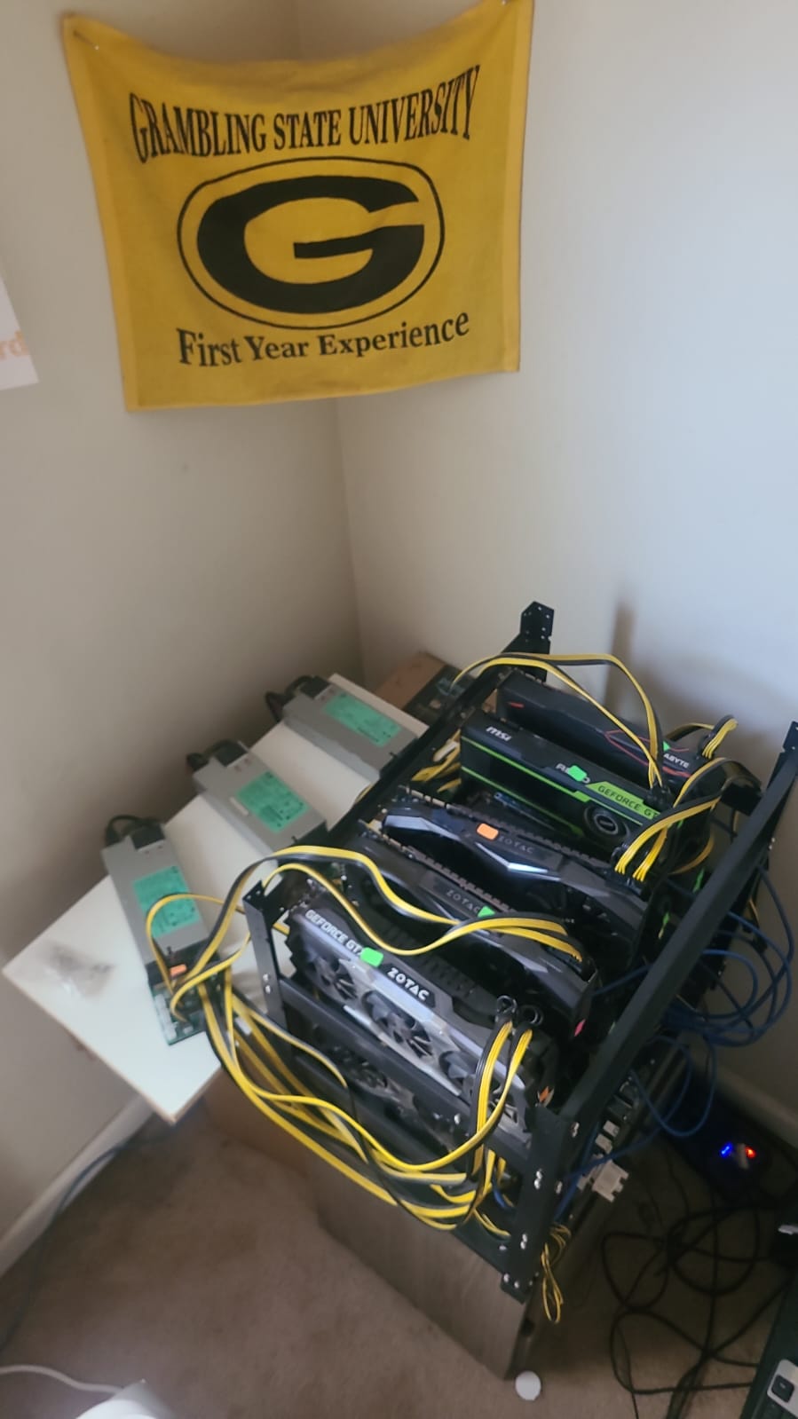 crypto mining rig with power supplies showing